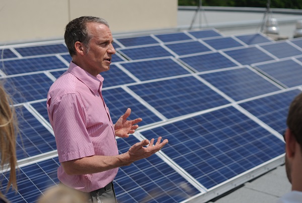 Alex Chapman leading a tour of the solar photovoltaic array on the roof of the River Run Centre, Guelph’s premier performing arts centre. 